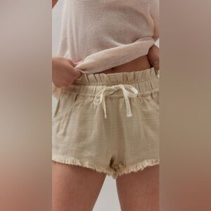 BDG Frankie Paperbag Micro Shorts in a cream or beige linen blend material.